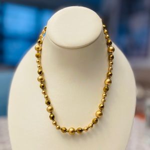 Vintage necklace. Gold color graduated beads. 18”. Good condition.